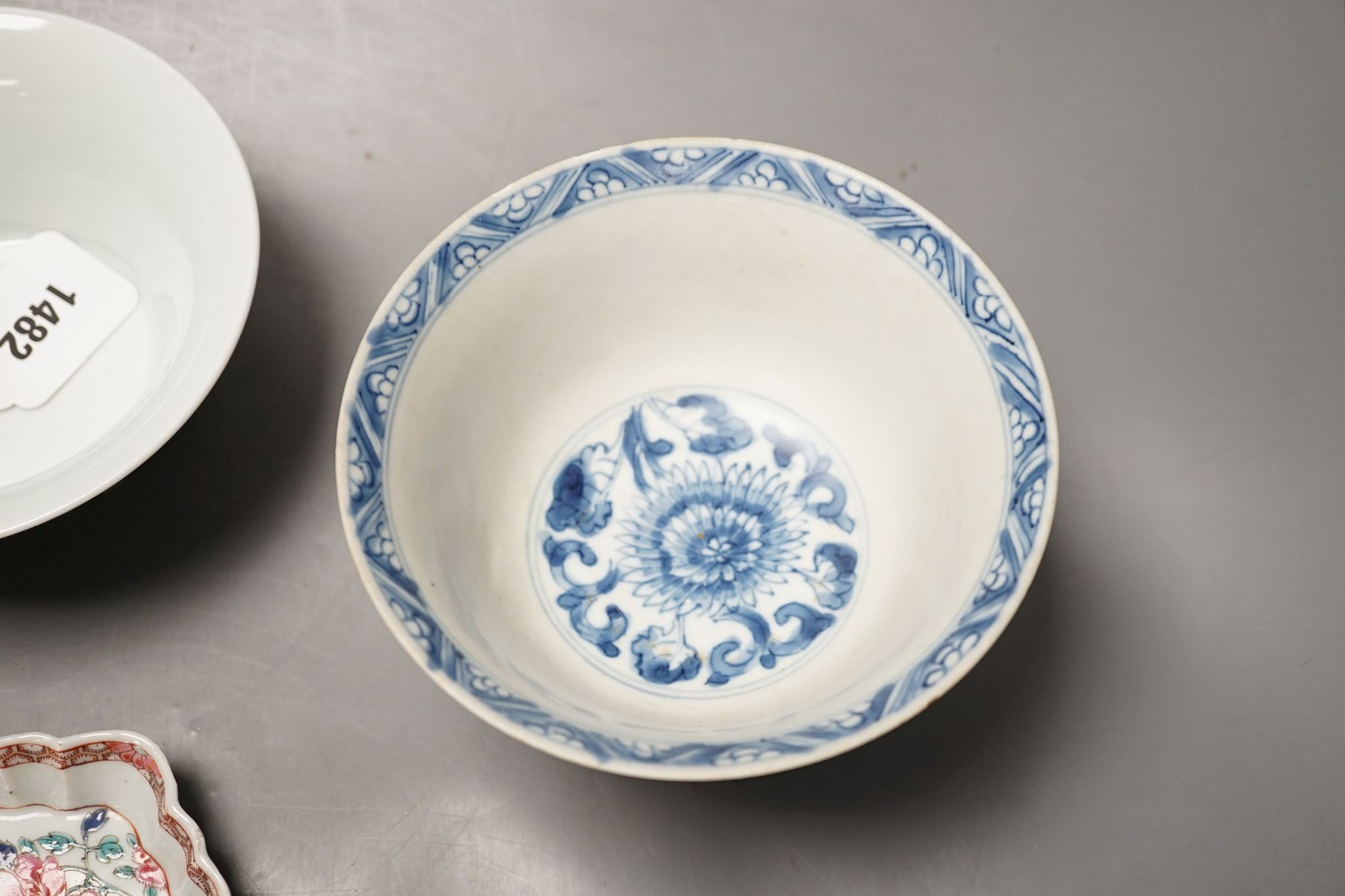 A Chinese blue and white bowl, Kangxi, 15cm. diam., a famille rose teapot stand, Yongzheng, and two doucai bowls
